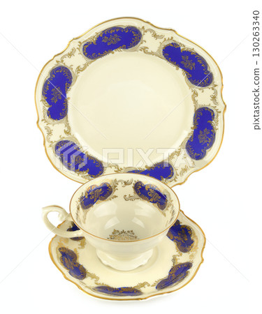 A White Tea Cup and Saucer with Gold Accents A White Tea Cup and Saucer with Gold Accents 130263340