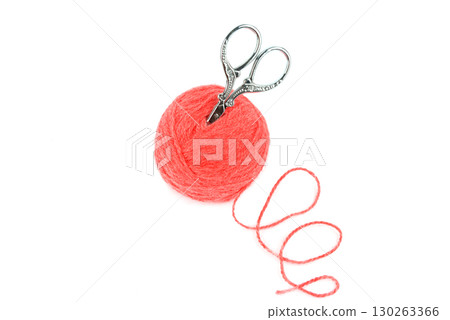Pink ball of yarn and vintage scissors isolated on white. 130263366
