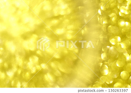 Abstract yellow light burst with circular bokeh effect and radiant highlights 130263397