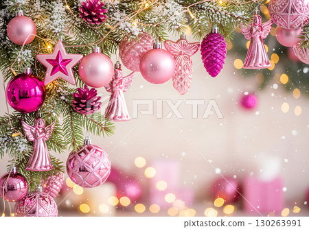 Christmas toys on a snow-covered spruce branch in rose and gold tones. Christmas toys on a snow-covered spruce branch in rose and gold tones. 130263991