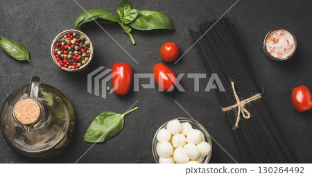 Black pasta with mozzarella cheese and fresh vegetables for italian cuisine 130264492