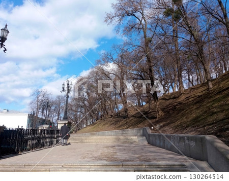 Autumn Walk Through the Kyiv Stairs in a Park With Colorful Foliage and Blue Skies Autumn Walk Through the Kyiv Stairs in a Park With Colorful Foliage and Blue Skies 130264514