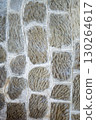 Weathered Dirty Wall made up from Gray Stone. old stone wall background. Unique pattern concrete exterior wall . High quality photo 130264617