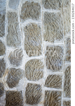 Weathered Dirty Wall made up from Gray Stone. old stone wall background. Unique pattern concrete exterior wall . High quality photo 130264617