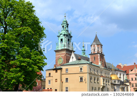 Beautiful Krakow market square. Faded colors. Vintage elegant carriages with beautifully dressed horses ride people around the historic center of Krakow on the old streets of Europe High quality photo Beautiful Krakow market square. Faded colors. Vintage elegant carriages with beautifully dressed horses ride people around the historic center of Krakow on the old streets of Europe High quality photo 130264669