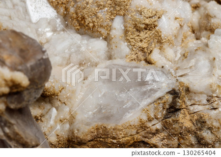 Macro mineral stone Snow quartz with calcite on a black background 130265404