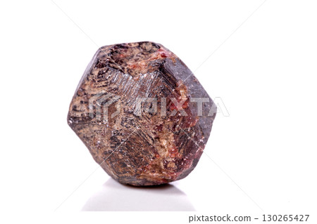 Macro of a mineral garnet stone on a white background Macro of a mineral garnet stone on a white background 130265427