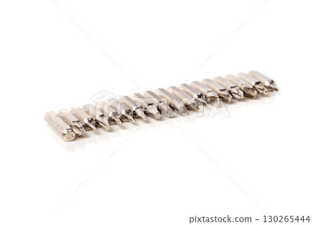 A set of different attachments for a head screwdriver with a screwdriver on a white background A set of different attachments for a head screwdriver with a screwdriver on a white background 130265444