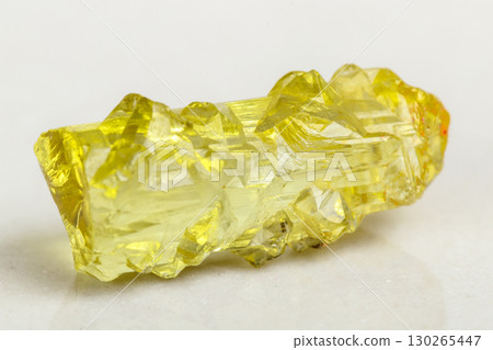 Macro mineral beryl heliodor stone on white background Macro mineral beryl heliodor stone on white background 130265447