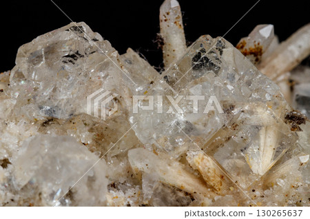 Macro mineral stone fluorite with quartz against black background Macro mineral stone fluorite with quartz against black background 130265637