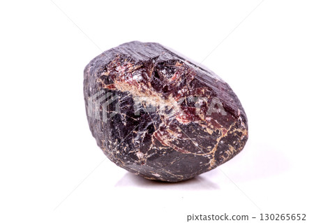Macro of a mineral garnet stone on a white background Macro of a mineral garnet stone on a white background 130265652