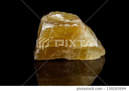 Macro mineral stone yellow Calcite on a black background Macro mineral stone yellow Calcite on a black background 130265694
