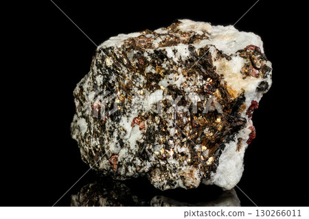 Macro Zircon mineral stone on a black background 130266011