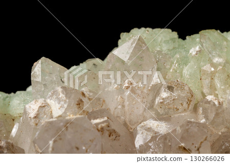 Macro mineral stone Prehnite quartz on a black background 130266026