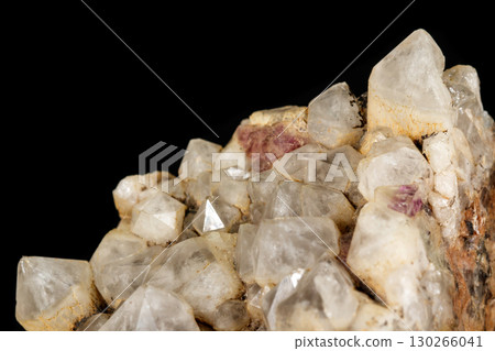 Macro mineral quartz stone with fluorite on granite on a black background 130266041