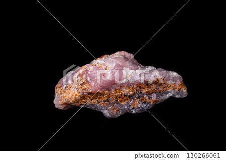 Macro pink Smithsonite mineral stone on microcline on black background Macro pink Smithsonite mineral stone on microcline on black background 130266061