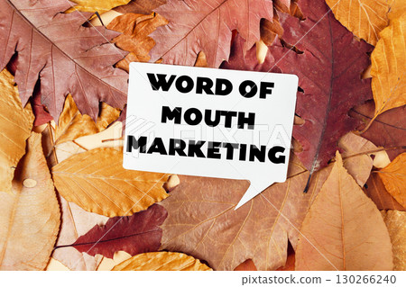 White sign with the word "mouth" written on it is placed on top of a pile of o White sign with the word "mouth" written on it is placed on top of a pile of o 130266240