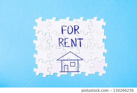Puzzle with a house on it and the words "for rent" written in blue Puzzle with a house on it and the words "for rent" written in blue 130266256