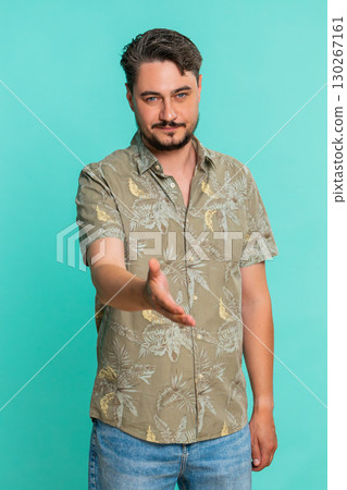 Man extending hand for handshake with friendly smile showing agreement, deal or mutual understanding 130267161