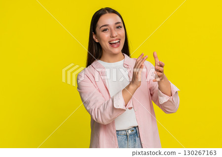Woman clapping hands with big smile joyful emotional applause showing support approval cheerful mood 130267163