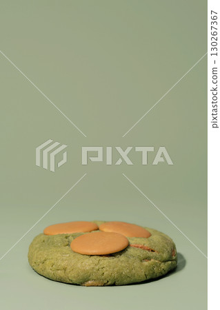 Pistachio cookies with creamy filling on a soft green background, showcasing bakery artistry and inviting presentation with ample copy space for menu design Pistachio cookies with creamy filling on a soft green background, showcasing bakery artistry and inviting presentation with ample copy space for menu design 130267367