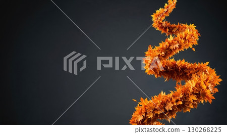 An elegant, winding cascade of vibrant orange and brown maple leaves creates a dynamic, abstract pattern against a dark, neutral background. 130268225