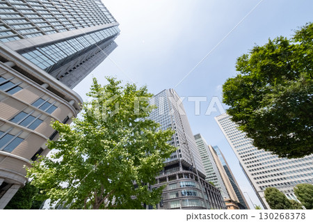 A view of an office district looking up at skyscrapers 130268378