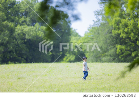 A boy playing in a park 130268598