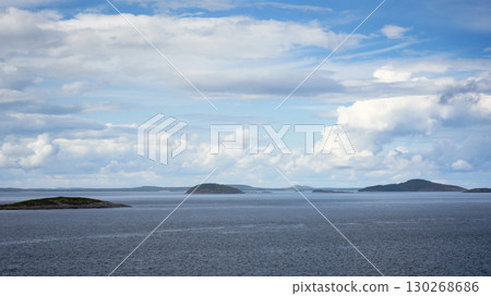 Majestic view with distant islands, water and expansive cloudy sky in White Sea in Karelia, concept of nature, background and travel 130268686