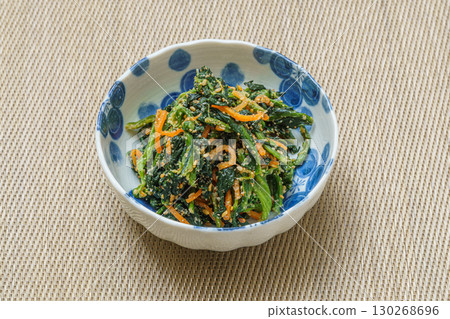 Colorful spinach dressed with sesame sauce served in a small bowl Colorful spinach dressed with sesame sauce served in a small bowl 130268696