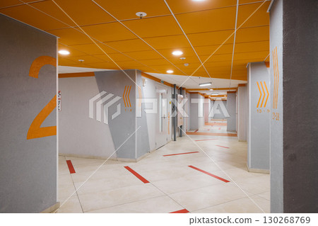 This modern corridor features unique designs that enhance its appeal and functionality This modern corridor features unique designs that enhance its appeal and functionality 130268769