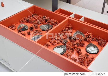 An Artistic Display of Beautiful Decorative Objects Whimsically Organized in a Modern Drawer 130268774