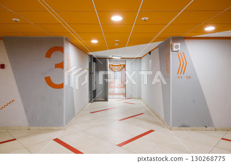 The modern corridor design features intricate geometric patterns and a variety of vibrant colors The modern corridor design features intricate geometric patterns and a variety of vibrant colors 130268775