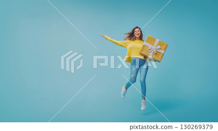 woman jeans gift arms turquoise background sweater box 130269379