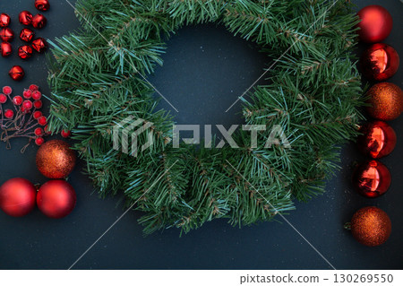 DIY process of woman making Christmas arrangement with decor in red color. Small business, self employed entrepreneur, self-made career. Series of handmade craft instruction. Zero waste eco-friendly 130269550