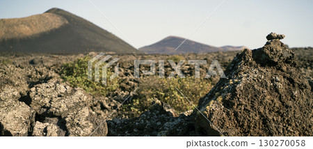 Landsape with volcanoes, mountains and volcanic rocky terrain. 130270058