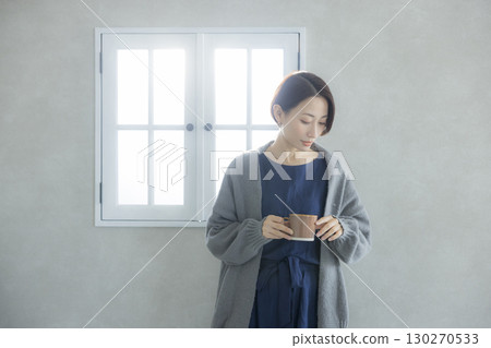 A woman looking out the window A woman looking out the window 130270533