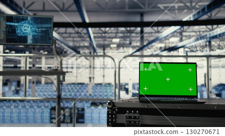 Green screen laptop in server hub with hardware supporting AI driven services. Mockup notebook in data center storing and processing vast datasets for artificial intelligence operations 130270671