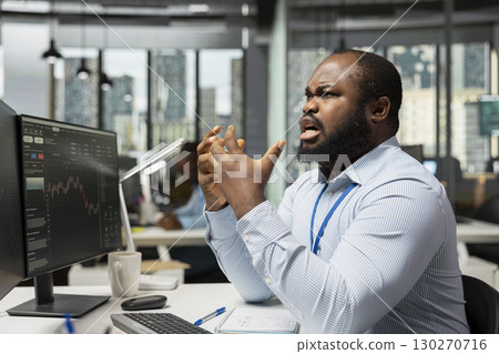 Angry portfolio manager frustrated by assets performance, adjusts holdings. Irked employee overseeing investment portfolios to maximize returns for clients annoyed by failure Angry portfolio manager frustrated by assets performance, adjusts holdings. Irked employee overseeing investment portfolios to maximize returns for clients annoyed by failure 130270716