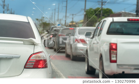 Cars are stuck in a traffic jam. Showing the back of the vehicles with a blurred background. Common sense on city roads during rush hour in Thailand. 130270996