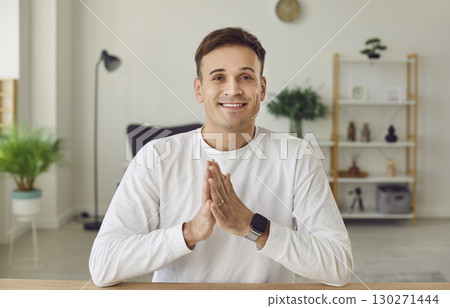 Portrait of happy, smiling business man at online work meeting via conference call Portrait of happy, smiling business man at online work meeting via conference call 130271444