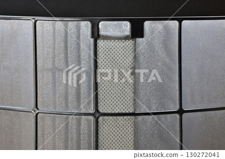 A thin layer of dust on the air conditioner filter A thin layer of dust on the air conditioner filter 130272041