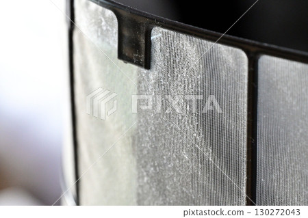 A thin layer of dust on the air conditioner filter A thin layer of dust on the air conditioner filter 130272043