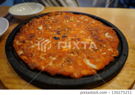 Korean Kimchi Pancake (Kimchijeon) on Hot Plate 130273251