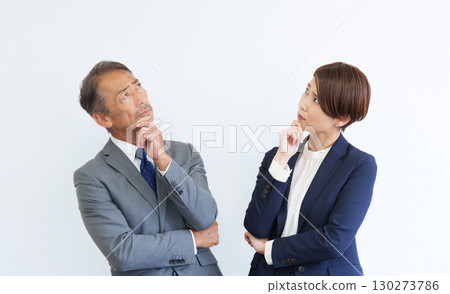 Thinking businessmen and women 130273786