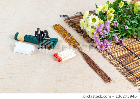 Grave visit accessories and a small doll in mourning clothes Grave visit accessories and a small doll in mourning clothes 130273940