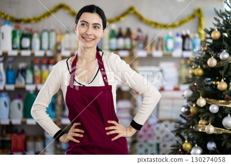 Woman seller in decorated household chemicals store Woman seller in decorated household chemicals store 130274058