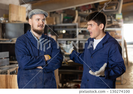 Quarrel between two workers at furniture factory - foreman yells at offending worker 130274100