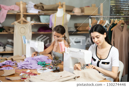 team of dressmakers sewing clothes 130274446