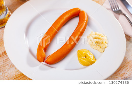 Popular Austrian sausages dish served with mustard and fresh horseradish Popular Austrian sausages dish served with mustard and fresh horseradish 130274586